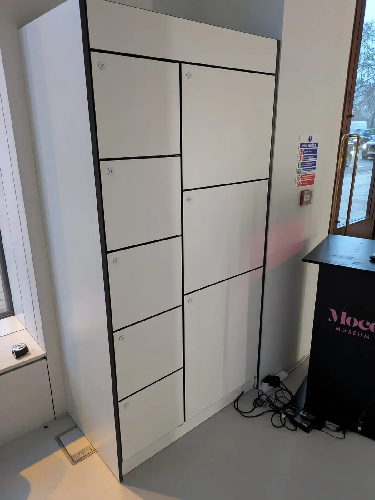 MOCO Museum London mixed-size visitor lockers beside the entrance